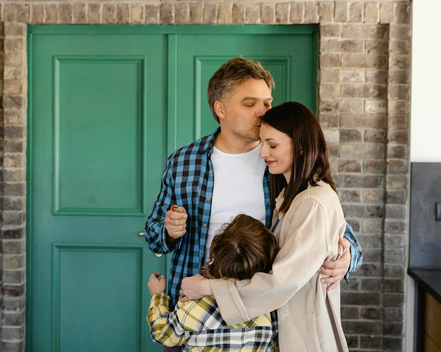 Family at the front door of their new home